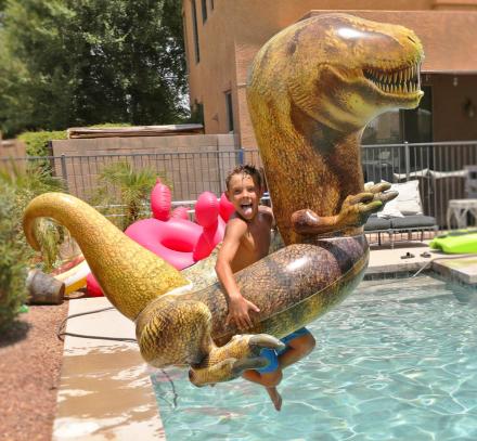 There’s Now a Giant T-Rex Pool Float, And Yes He Even Has Tiny Little Arms