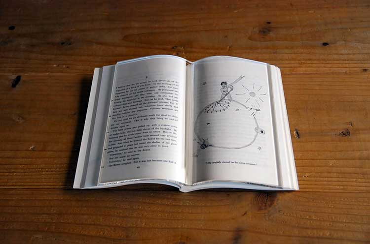 Glass Book Page Holder 1Book on Book Glass Page Holder - Transparent acrylic book shaped glass holds pages of books open