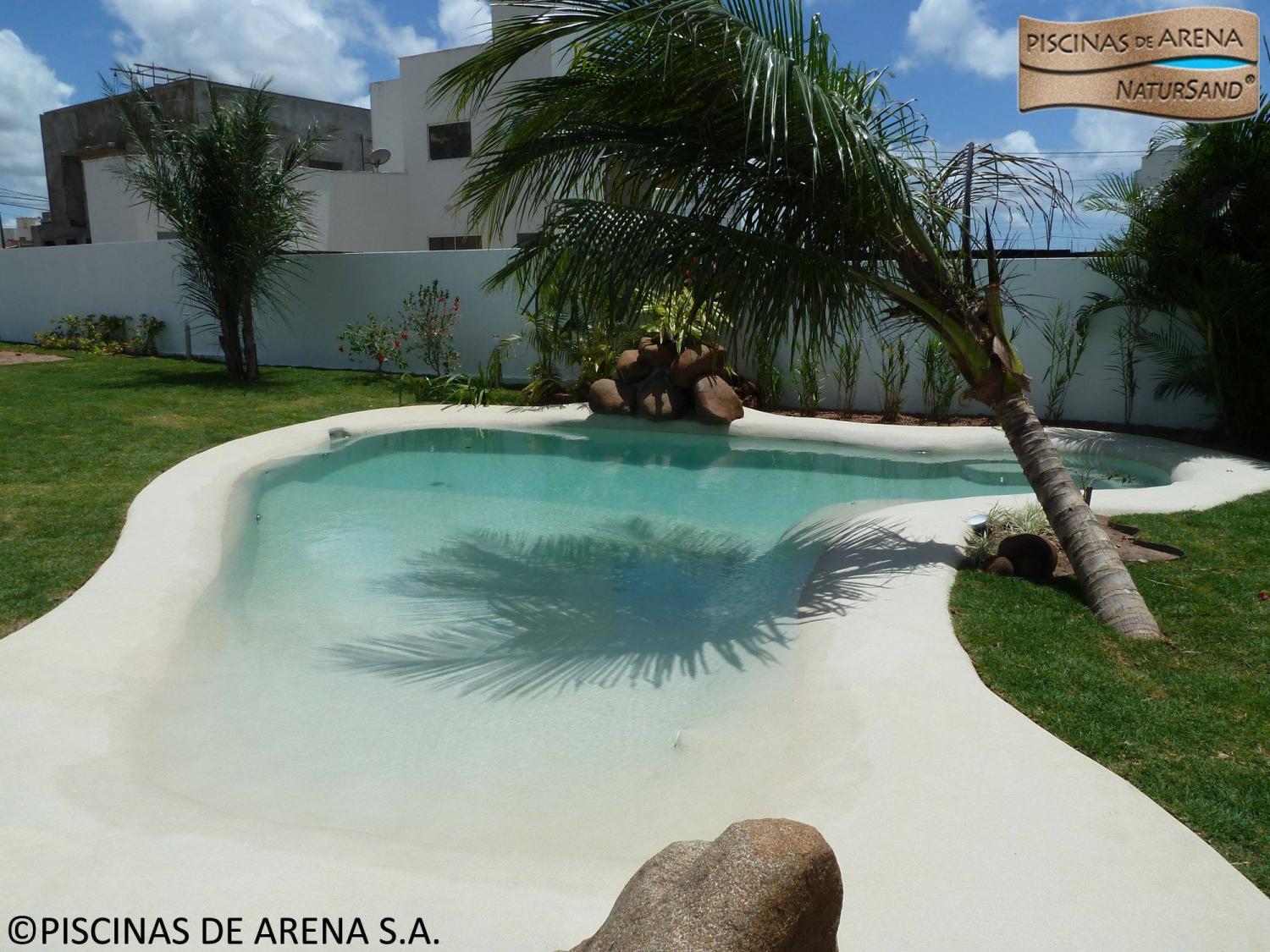 Beach entry walk in pools made from real sand