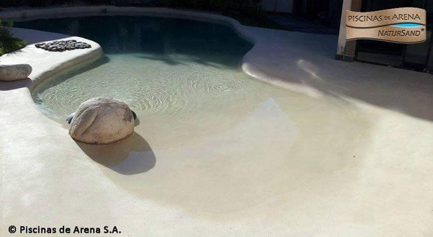 Beach entry walk in pools made from real sand
