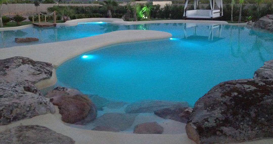 Beach entry walk in pools made from real sand