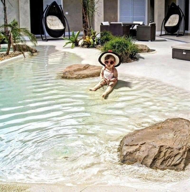 Beach entry walk in pools made from real sand