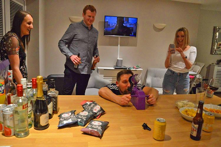 Dropshot drinking game - Russian roulette party game drops a shot in your mouth at random - Hot potato drinking game