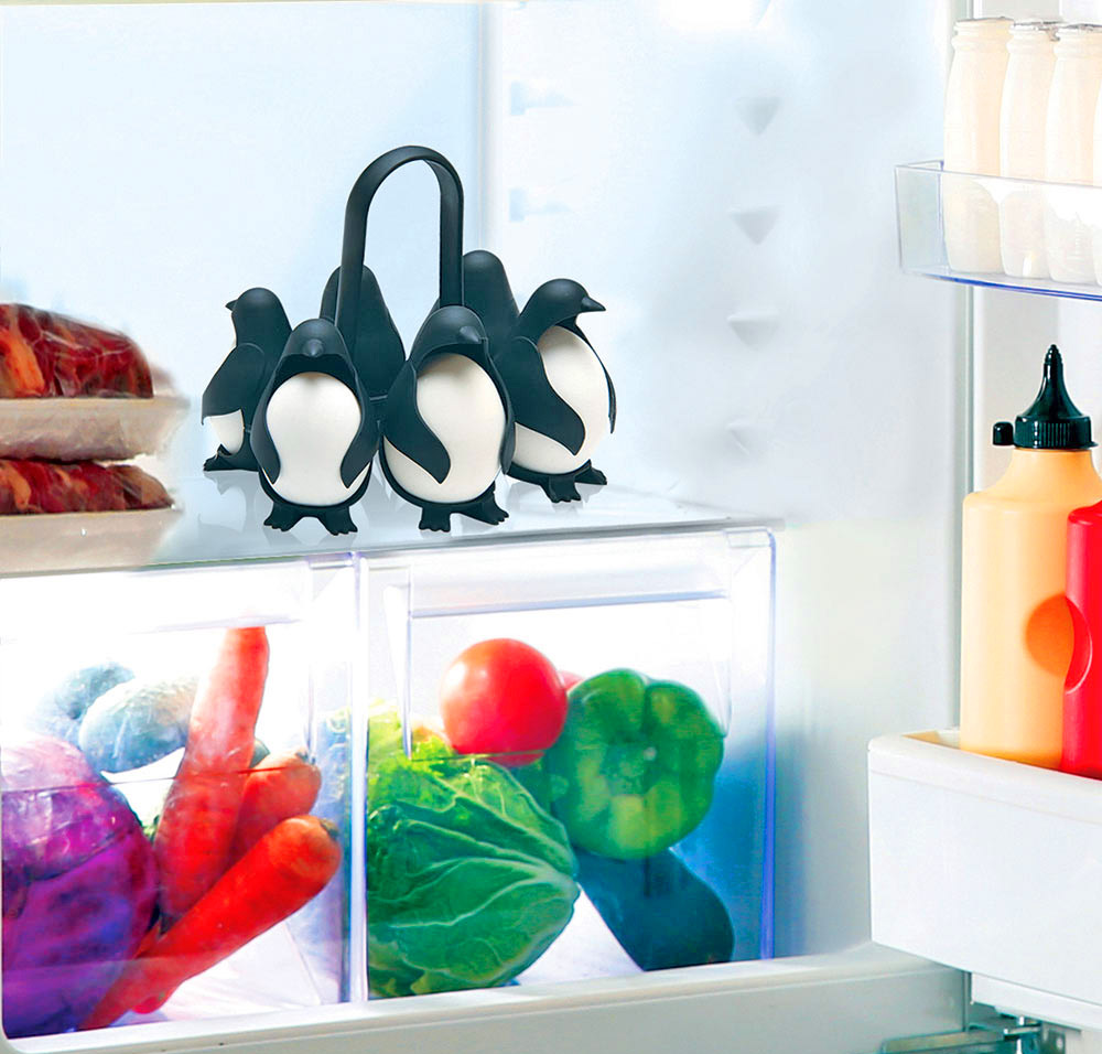 Egguins Penguin egg holders hold eggs under boiling water - penguin shaped egg server