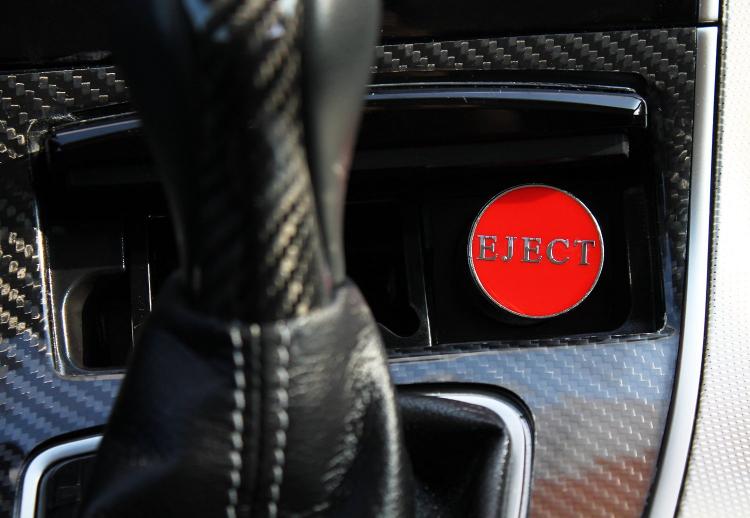 Fake eject button for car cigarette lighter