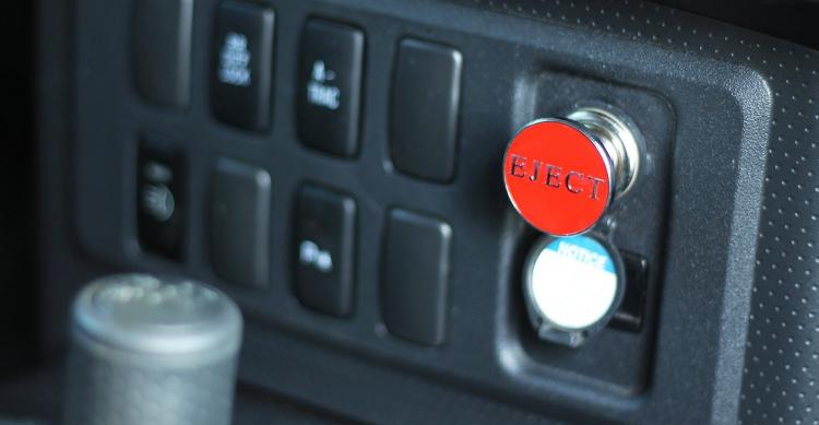 Fake eject button for car cigarette lighter