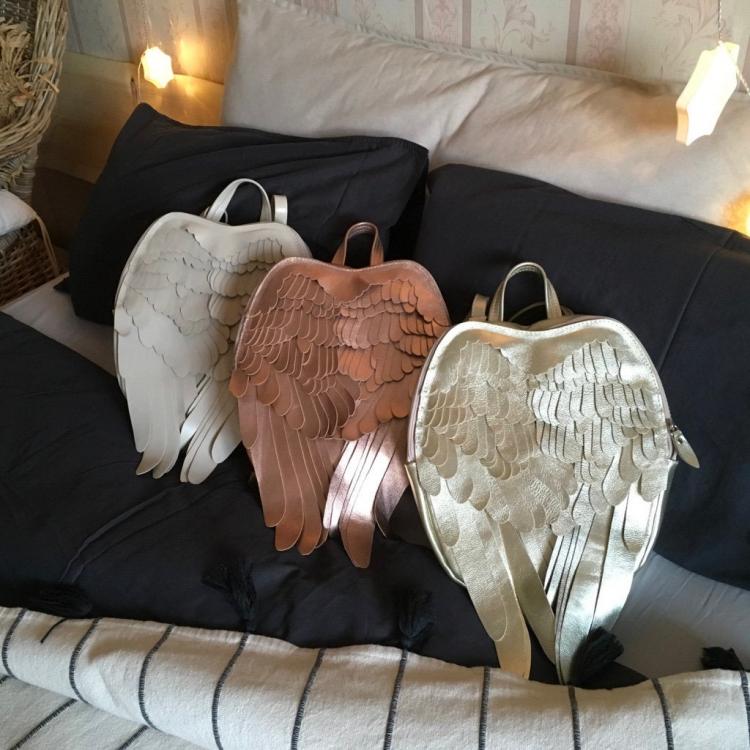Unique leather backpacks that give you feathery wings - stylish winged backpack