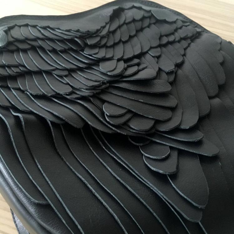 Unique leather backpacks that give you feathery wings - stylish winged backpack