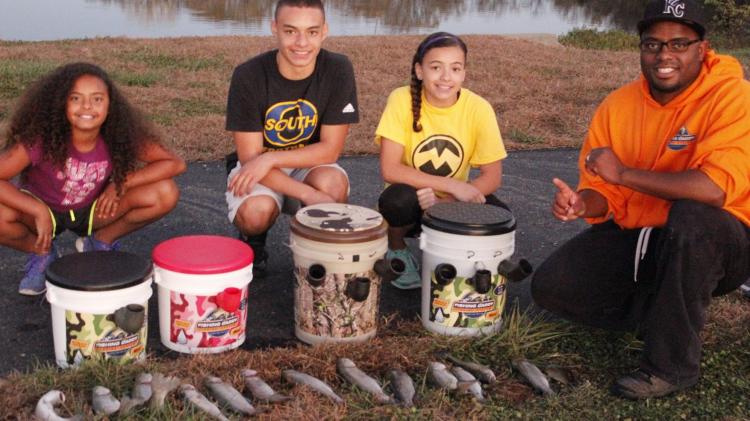 Fishing Caddy bucket combines a seat, tackle-box, and pole holder - Fishing bucket