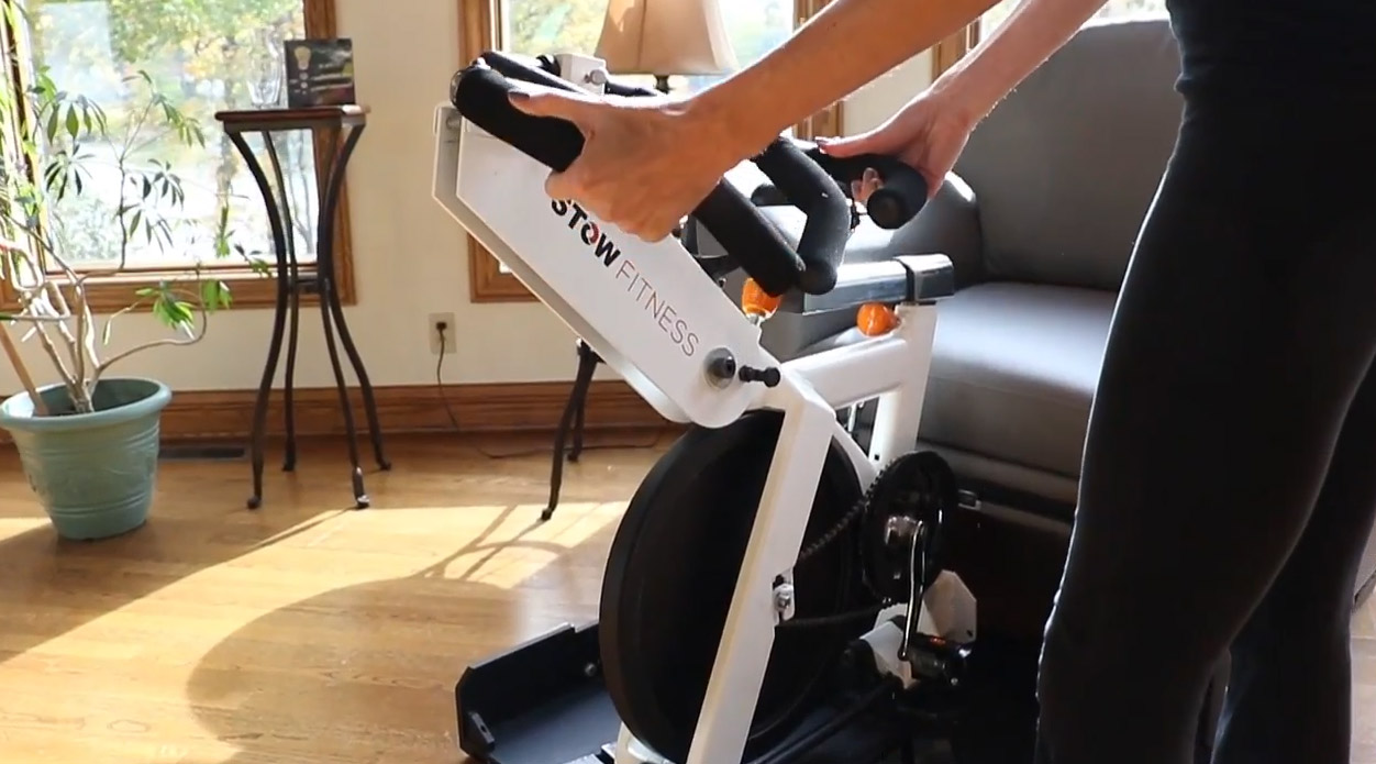 Stow-Away Fitness Equipment That Hides Inside Furniture When Not In Use - folding exercise bike inside armchair