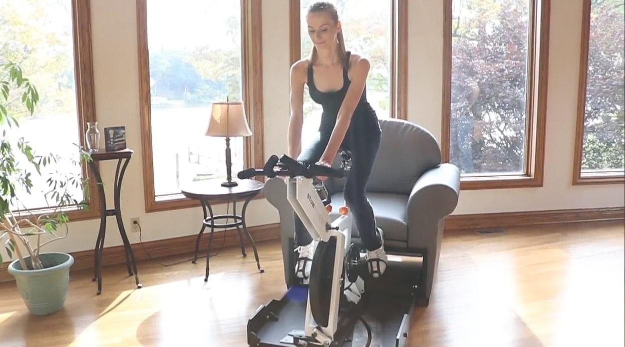 Stow-Away Fitness Equipment That Hides Inside Furniture When Not In Use - folding exercise bike inside armchair