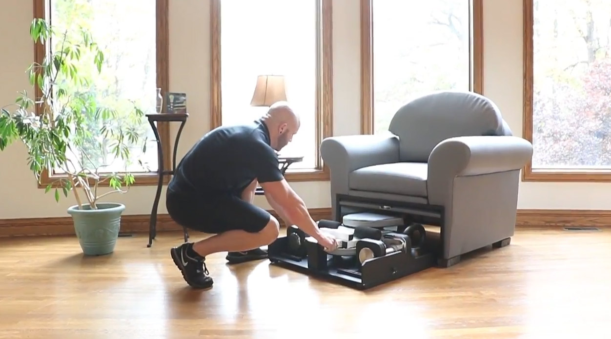 Stow-Away Fitness Equipment That Hides Inside Furniture When Not In Use - folding exercise bike inside armchair