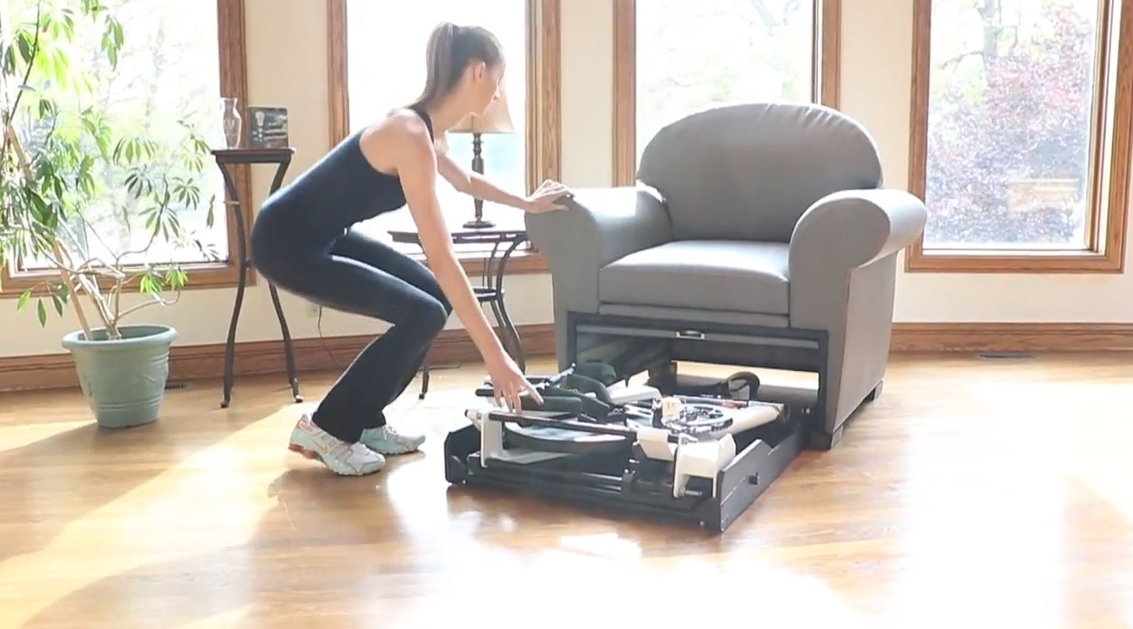 Stow-Away Fitness Equipment That Hides Inside Furniture When Not In Use - folding exercise bike inside armchair