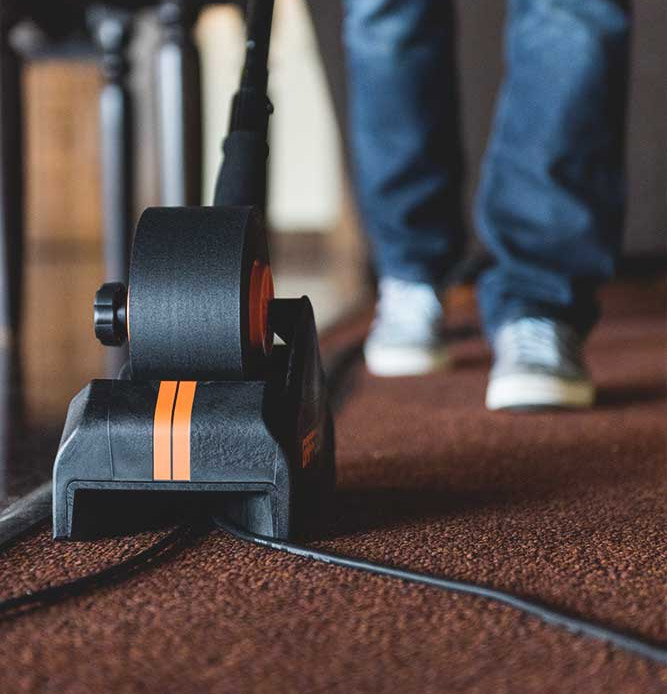 Gaff Gun Automatically Tapes Down Cords To Your Floor