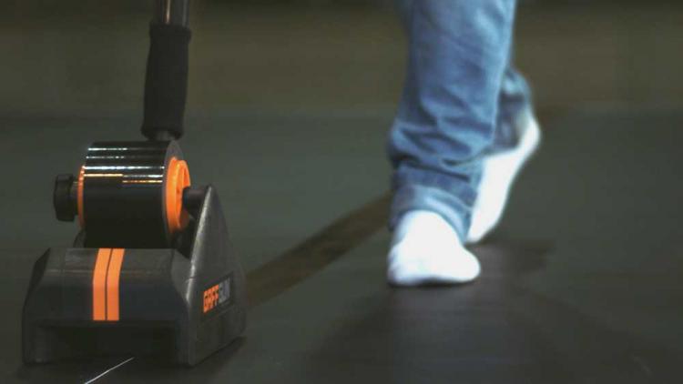 Gaff Gun Automatically Tapes Down Cords To Your Floor