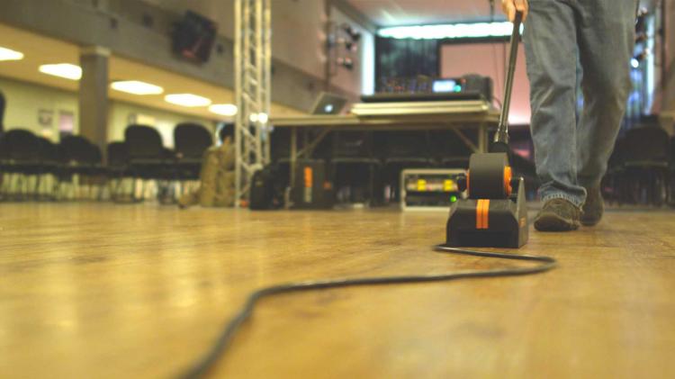 Gaff Gun Automatically Tapes Down Cords To Your Floor