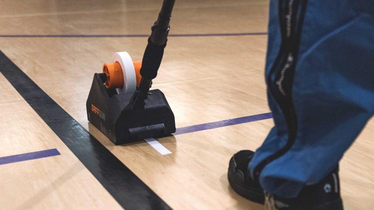 Gaff Gun Automatically Tapes Down Cords To Your Floor