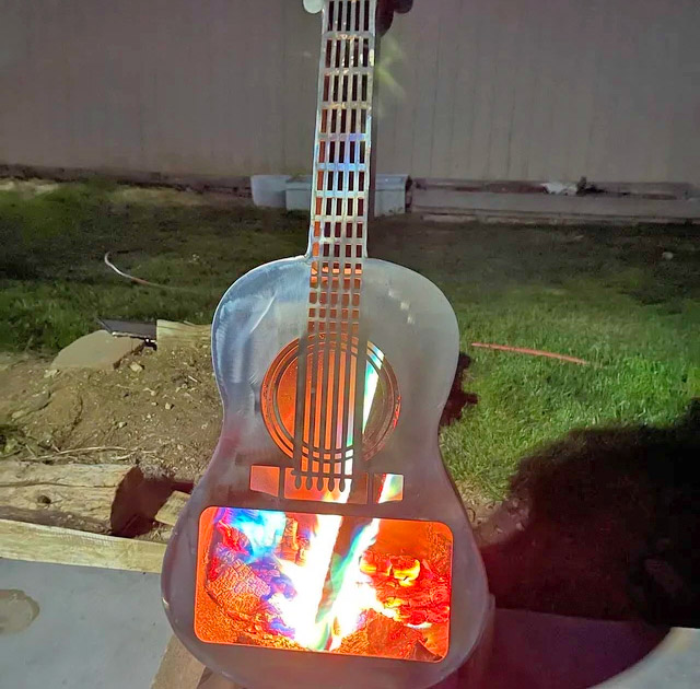 Guitar Fire Pit - Metal guitar shaped wood burning stove