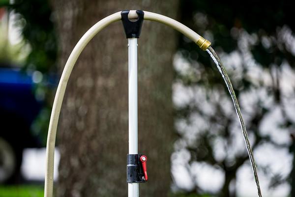 Hose Hooker Holds Your Garden Hose In Place For Washing Your Dog