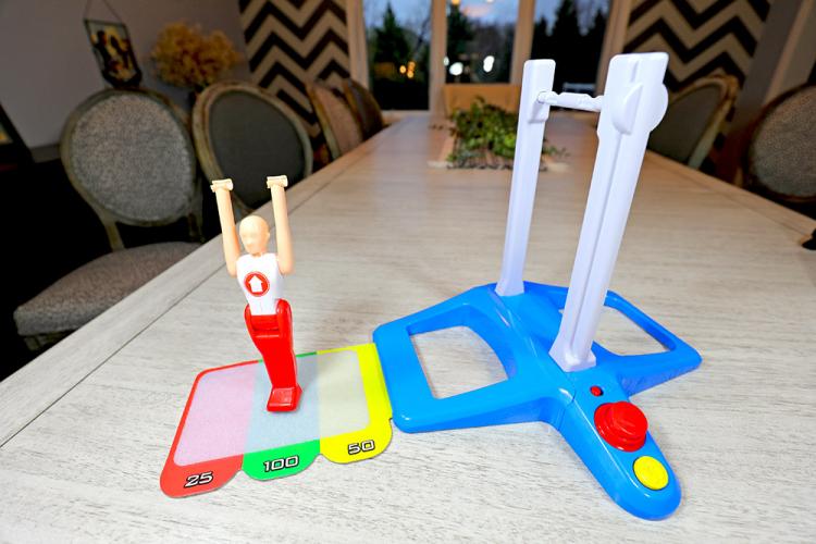 Spinning Gymnastics Toy - Spin gymnast around bar and land on velcro mat