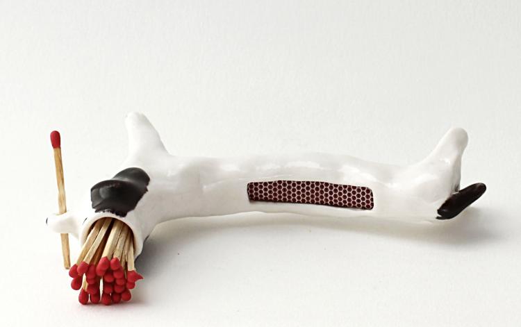 Matchstick Holding Dog - With Striker Area on Its Back