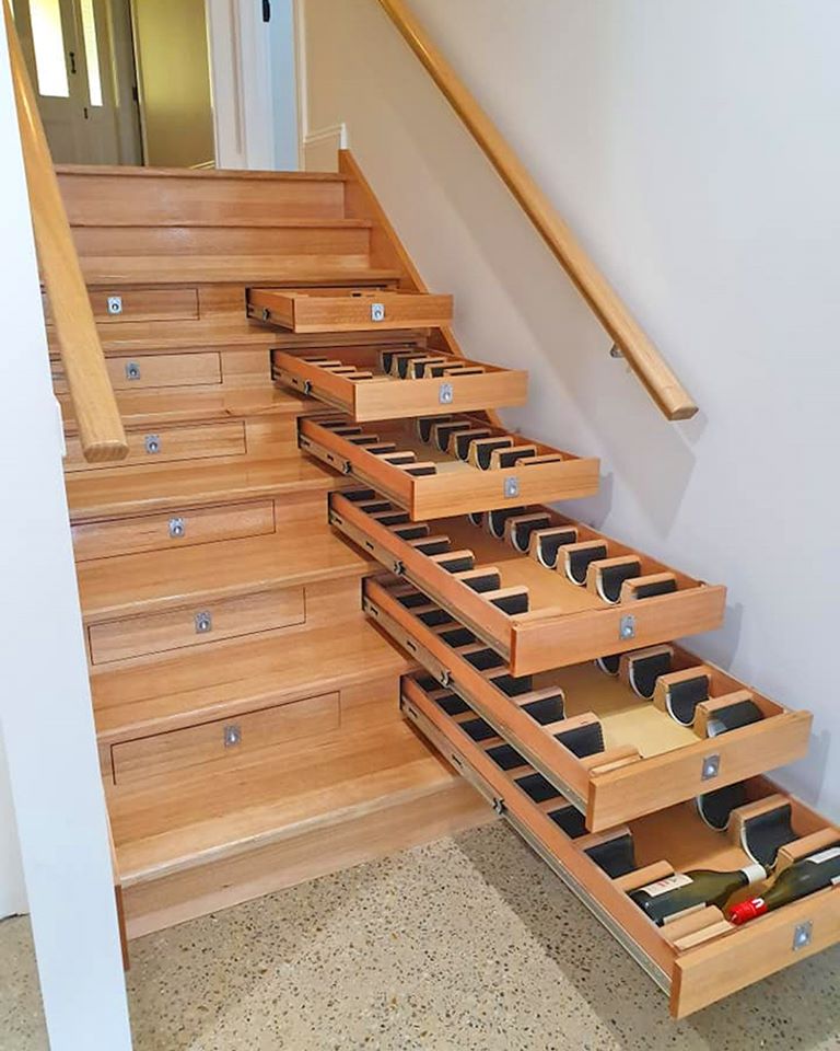 Most Creative Under The Stairs Home Designs - Hidden wine storage drawers inside stairs