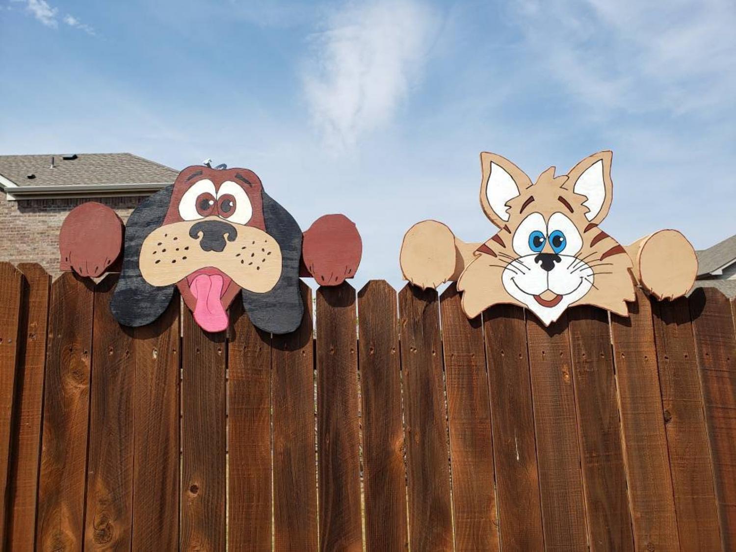 dog and cat fence sitters that peek over the fence at the neighbors dog and cat fence sitters that peek over the fence at the neighbors