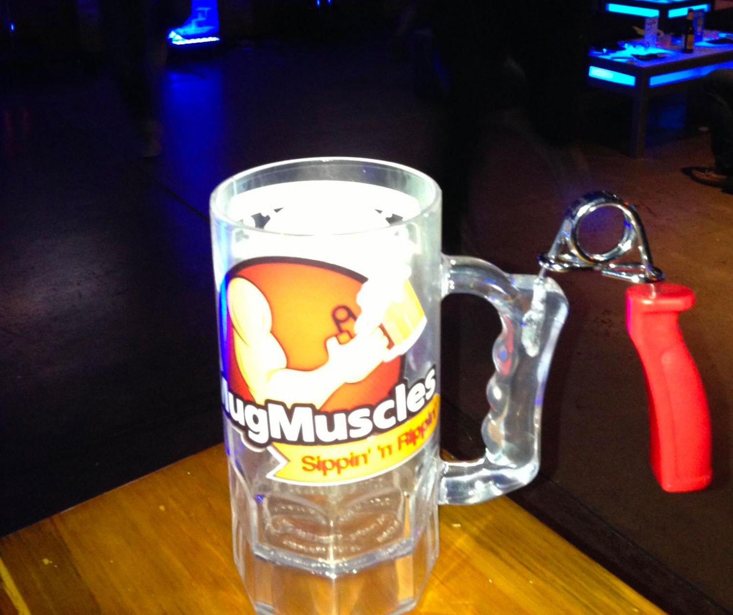 Mug Muscle Workout Mug With Hand Exercise Tool On It