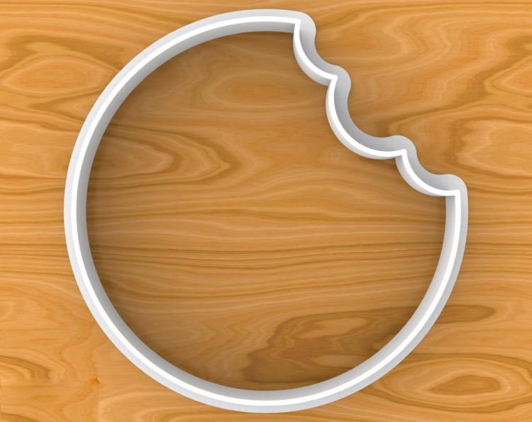 Once bitten cookie cutter - Cookie cutter makes cookies with a bite already taken out of cookie