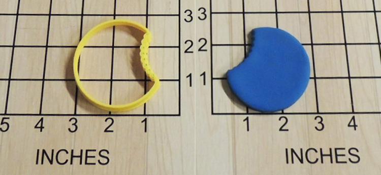 Once bitten cookie cutter - Cookie cutter makes cookies with a bite already taken out of cookie