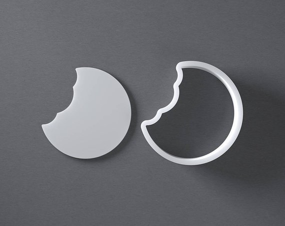 Once bitten cookie cutter - Cookie cutter makes cookies with a bite already taken out of cookie