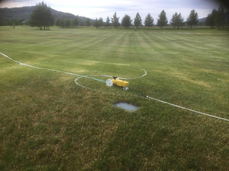 Raintrain Traveling Sprinkler - Robotic sprinkler crawls across lawn