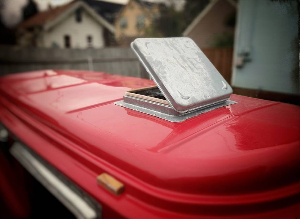 Retro Camper Boat - 1950's Teardrop trailer with row boat as roof of camper