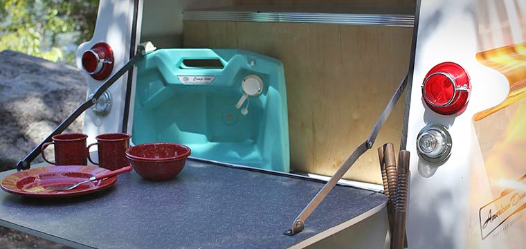 Retro Camper Boat - 1950's Teardrop trailer with row boat as roof of camper