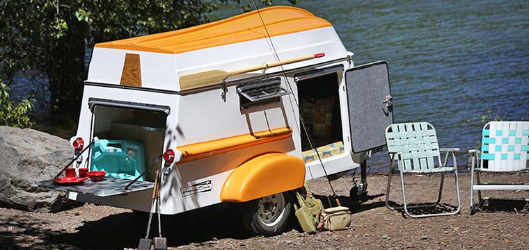 Retro Camper Boat - 1950's Teardrop trailer with row boat as roof of camper