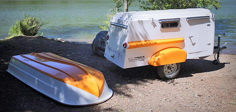 Retro Camper Boat - 1950's Teardrop trailer with row boat as roof of camper
