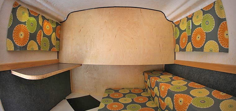 Retro Camper Boat - 1950's Teardrop trailer with row boat as roof of camper