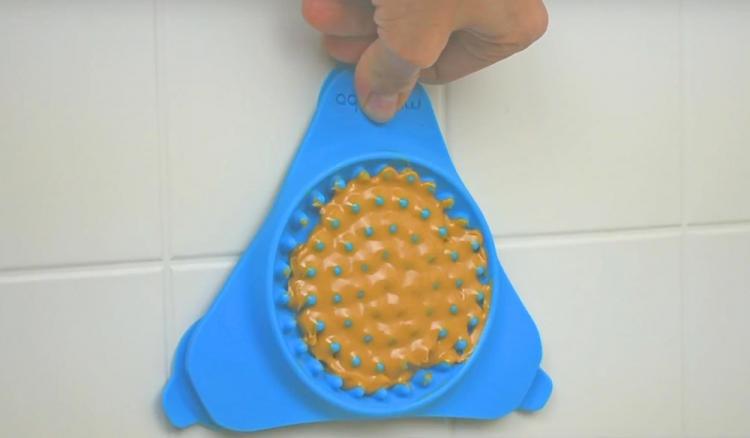 Slow Treater: Wall Mounted Treat Lick To Distract Dogs While Bathing - Peanut butter dog bath distraction tool