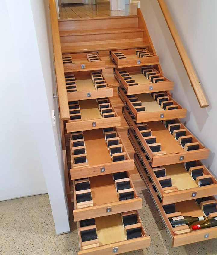Builder Turned Their Staircase Into an Incredible Wine Cellar - Staircase wine storage drawers system