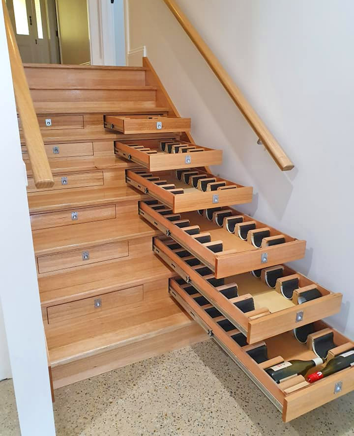 Builder Turned Their Staircase Into an Incredible Wine Cellar - Staircase wine storage drawers system