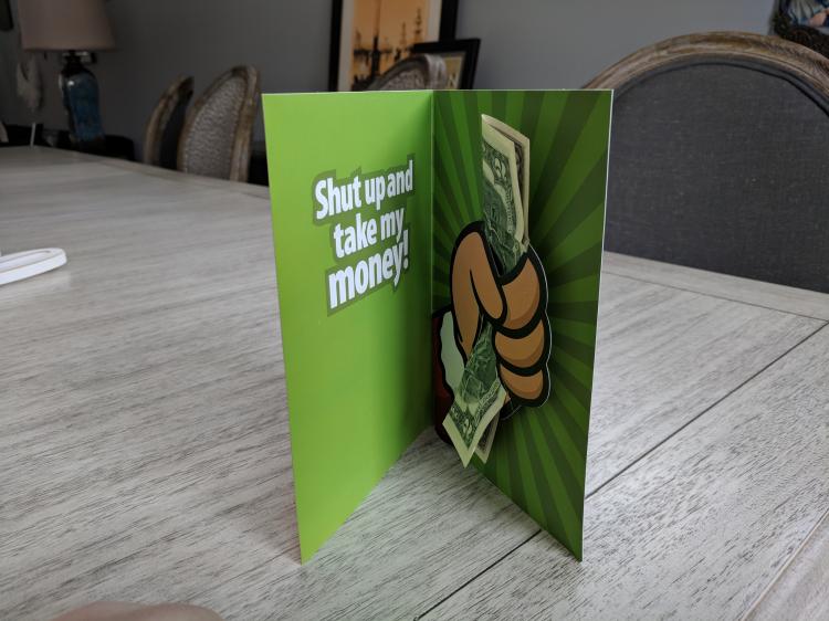 Shut up and take my money Christmas card - Hand giving cash pop-up Christmas card