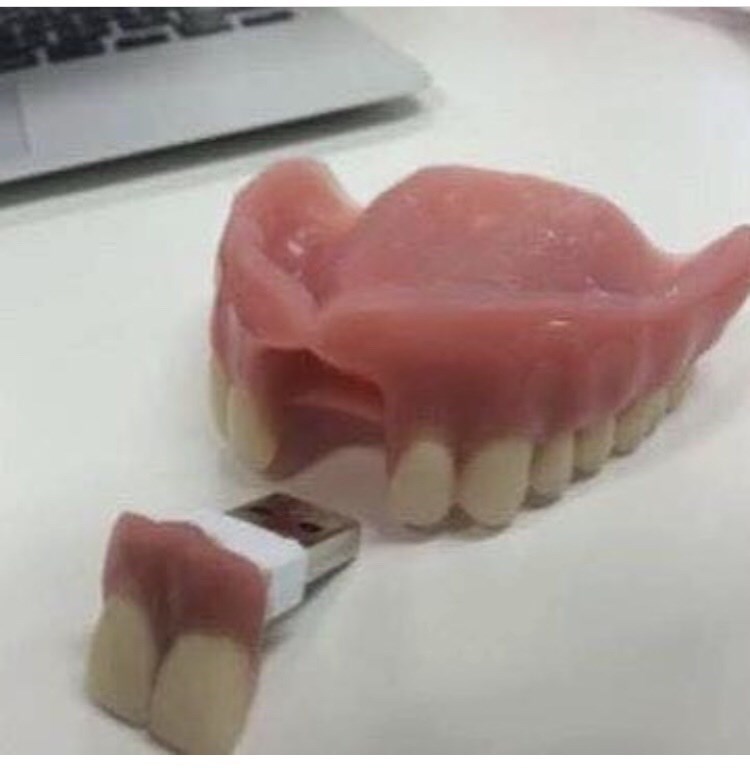 usb stick dentures in teeth
