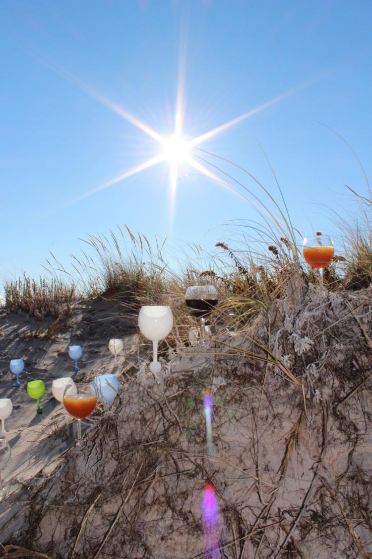 The Beach Glass - Floats In Water - Stabs Into Sand