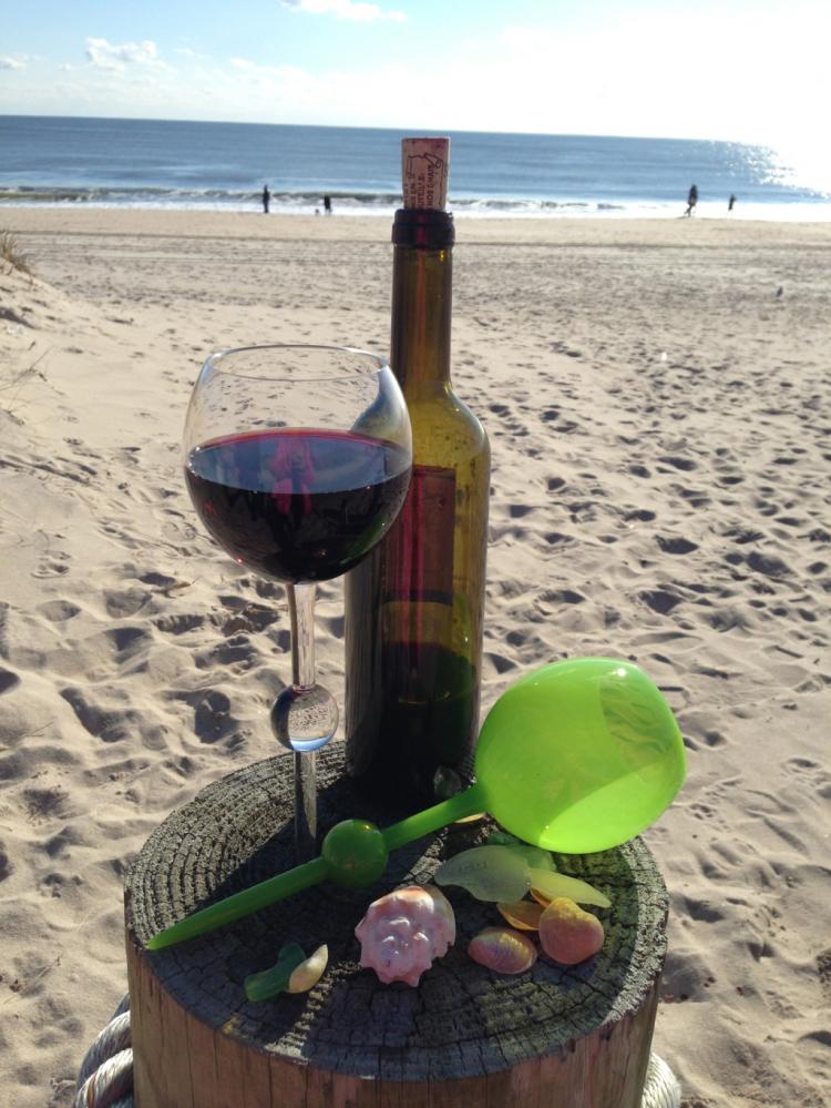 The Beach Glass - Floats In Water - Stabs Into Sand