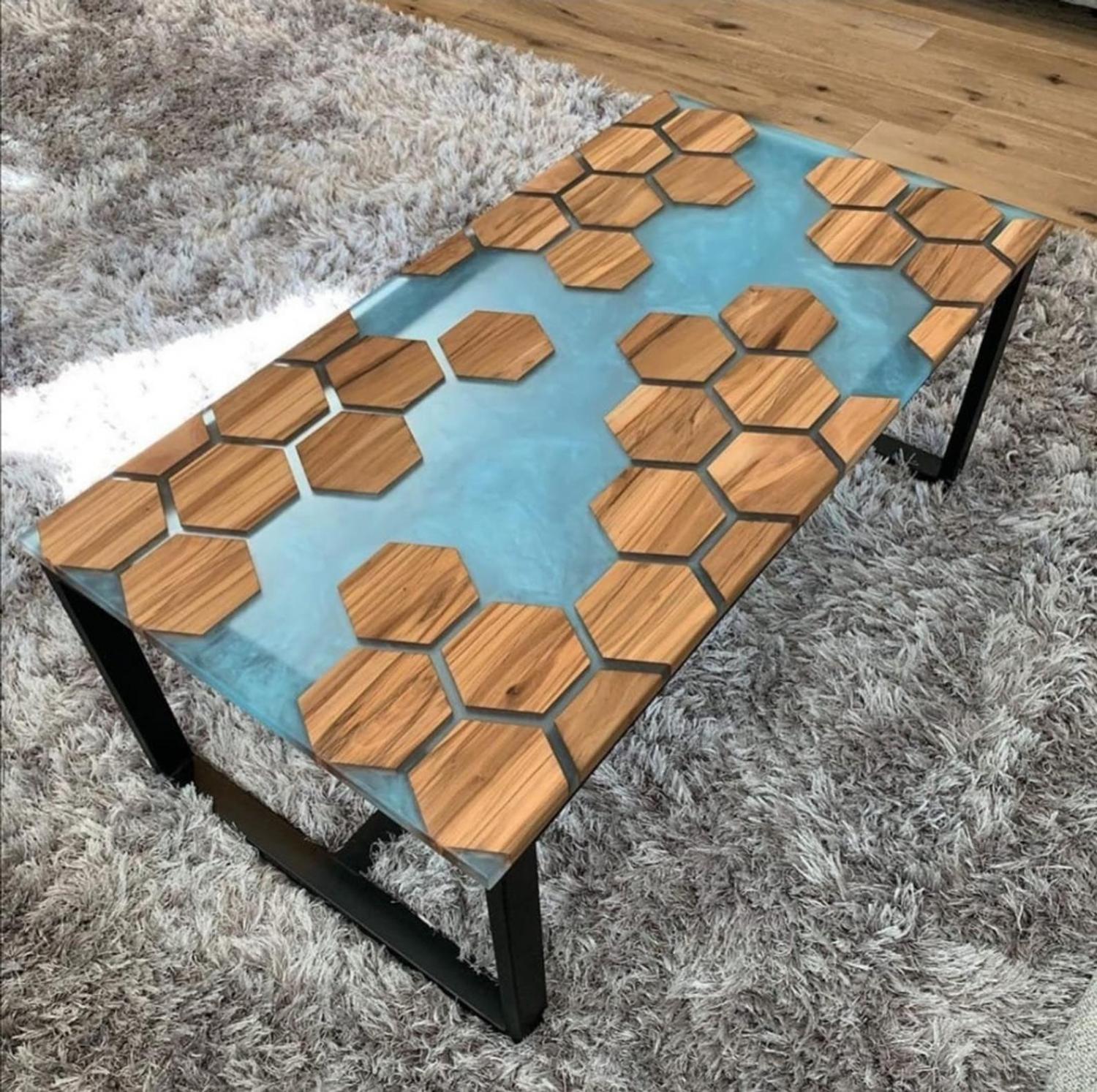 A stunning epoxy table made with wooden polygons with blue resin in-between