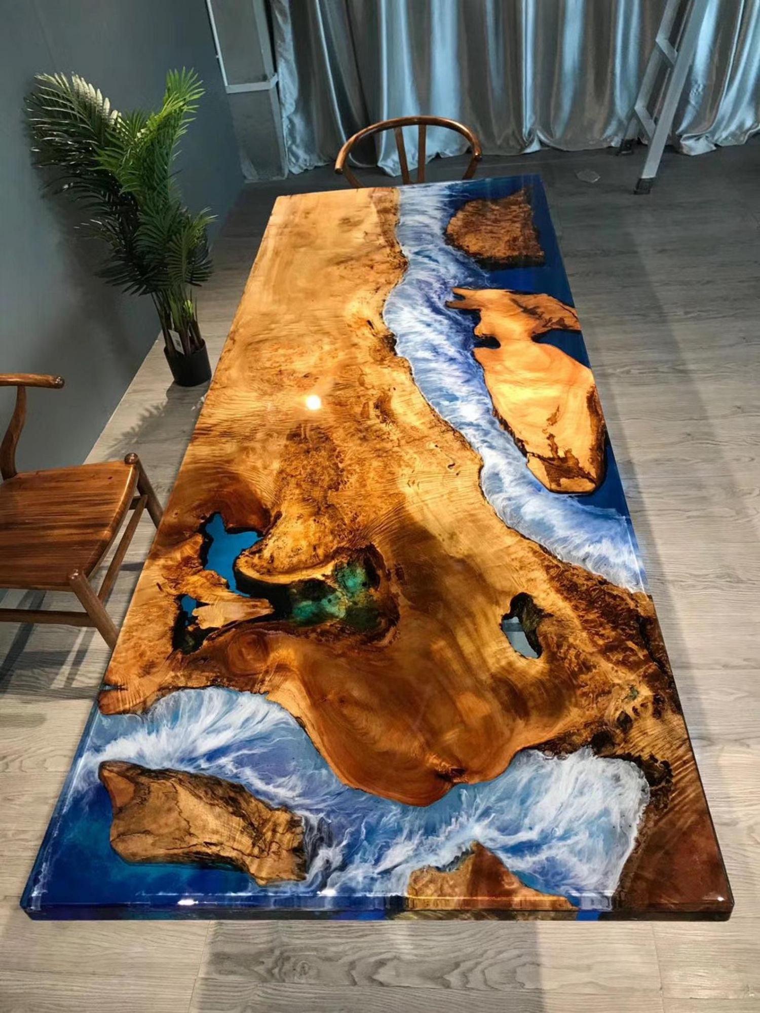 Another beautiful epoxy/resin table with bright blue waters and amazing shorelines with amazing colors