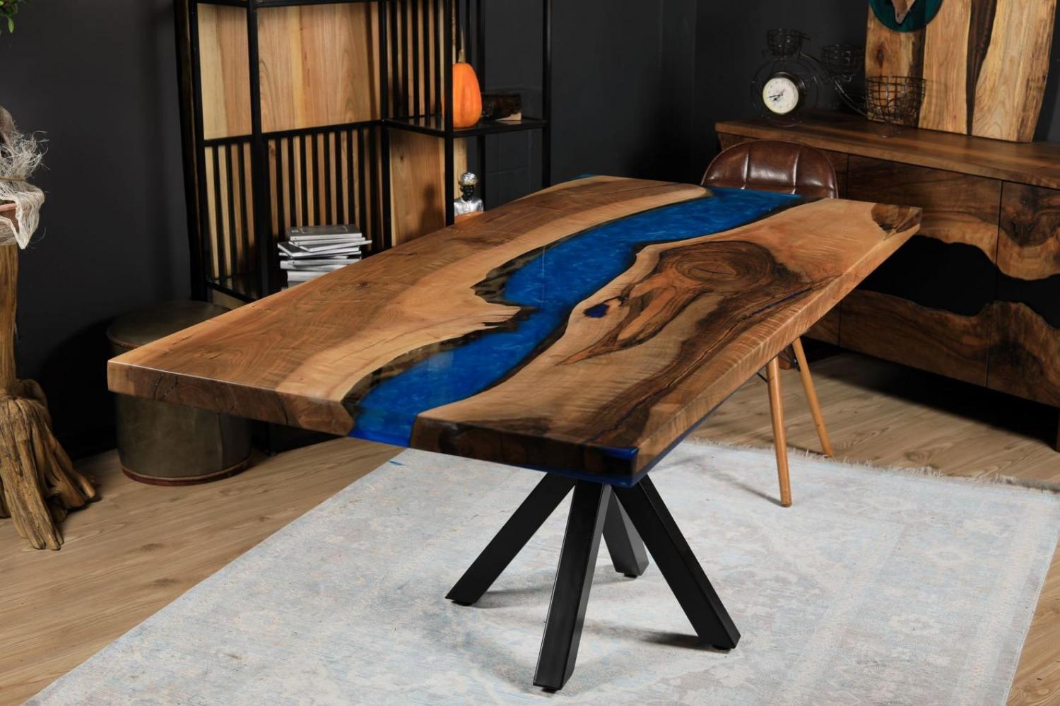 A classy epoxy table with a blue river that's fit for a study or office