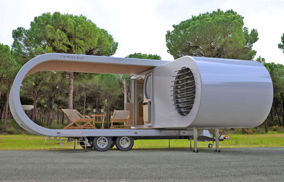Futuristic Camping Trailer Rotates Around To Reveal Huge Party Deck - Romotow swiveling luxury camper