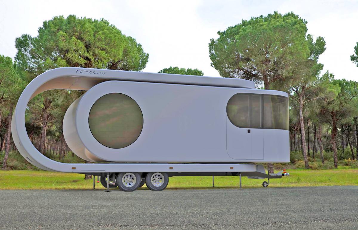 Futuristic Camping Trailer Rotates Around To Reveal Huge Party Deck - Romotow swiveling luxury camper