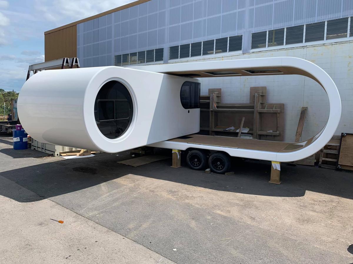 Futuristic Camping Trailer Rotates Around To Reveal Huge Party Deck - Romotow swiveling luxury camper